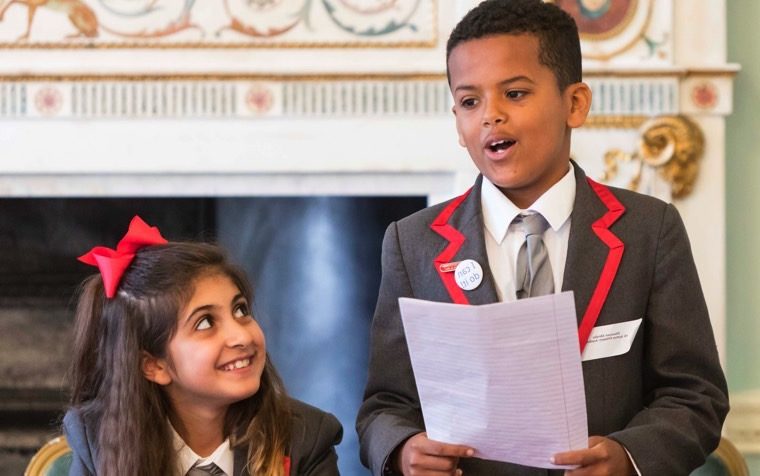 Image of two primary kids at discover debating