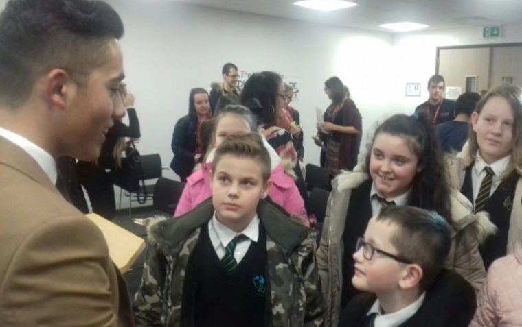 A picture of Ahmad Nawaz talking to primary school pupils at Walsall College