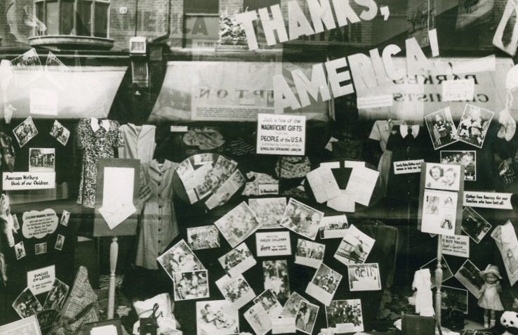 A black and white window display of clothing sent by the ESU to the USA