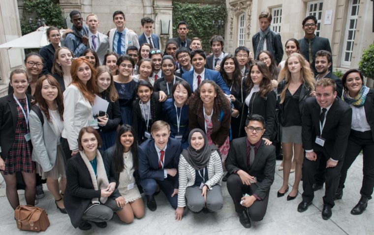 A large group of teenagers in marble courtyard of Dartmouth House, the headquarters of the English Speaking Union