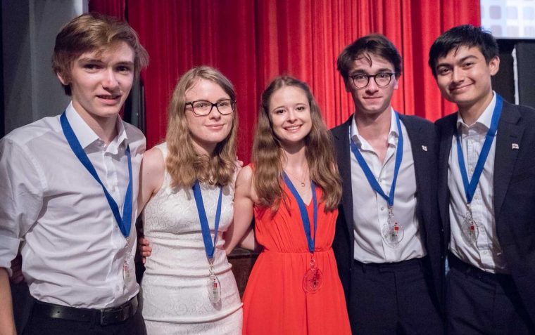 Team England posing for a photo with their medals for the World Schools Debating Championships