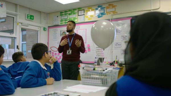 Teacher presenting Oracy in Action to his class