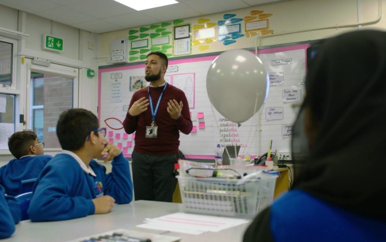 Teacher presenting Oracy in Action to his class