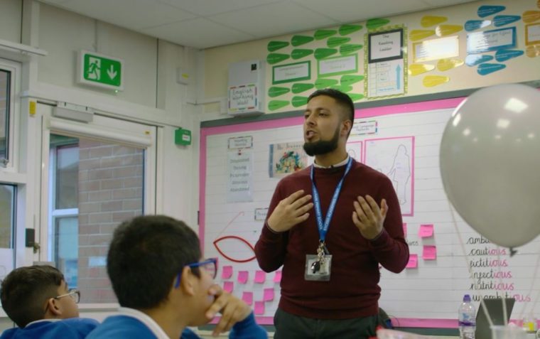 Teacher presenting Oracy in Action to his class