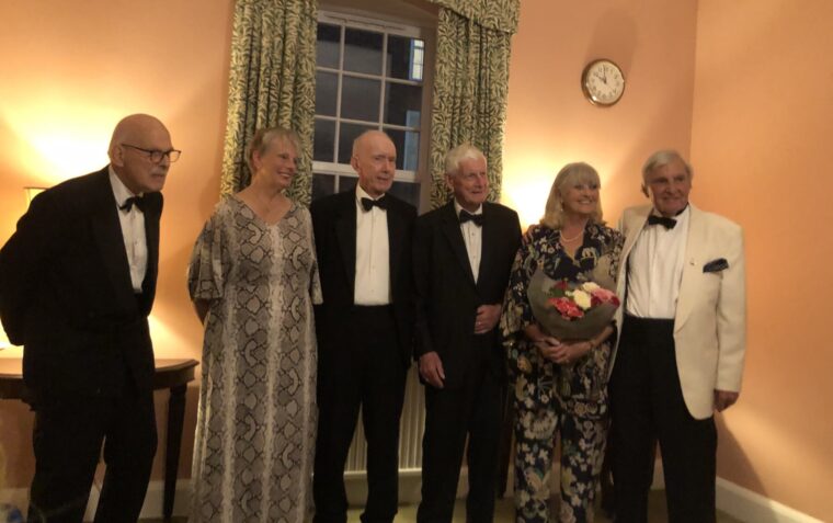 A group assembling for a picture in the drawing room
